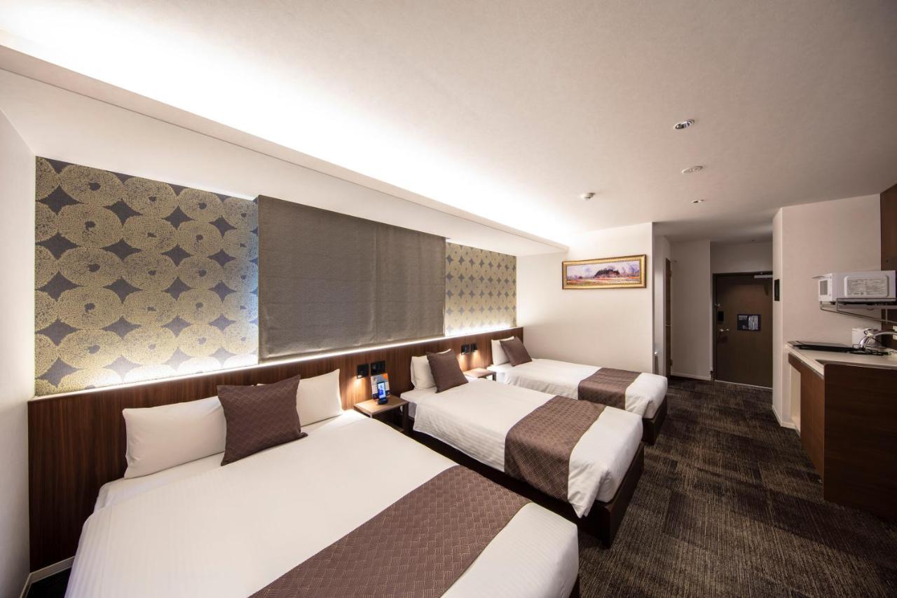 Апарт отель Grand Base Okayama Ekimae Экстерьер фото